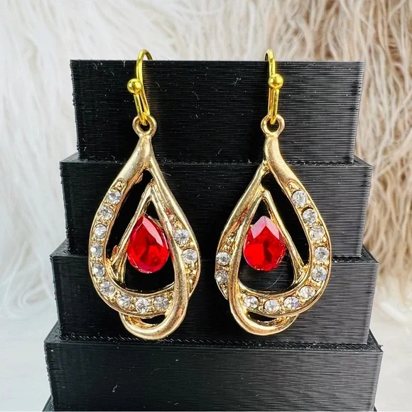 Pretty aged goldtone red and clear bling accent pierced earrings